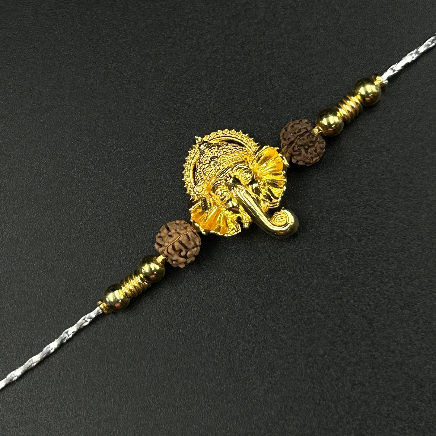 Yellow Gold Ganesh Rakhi with Rudraksh