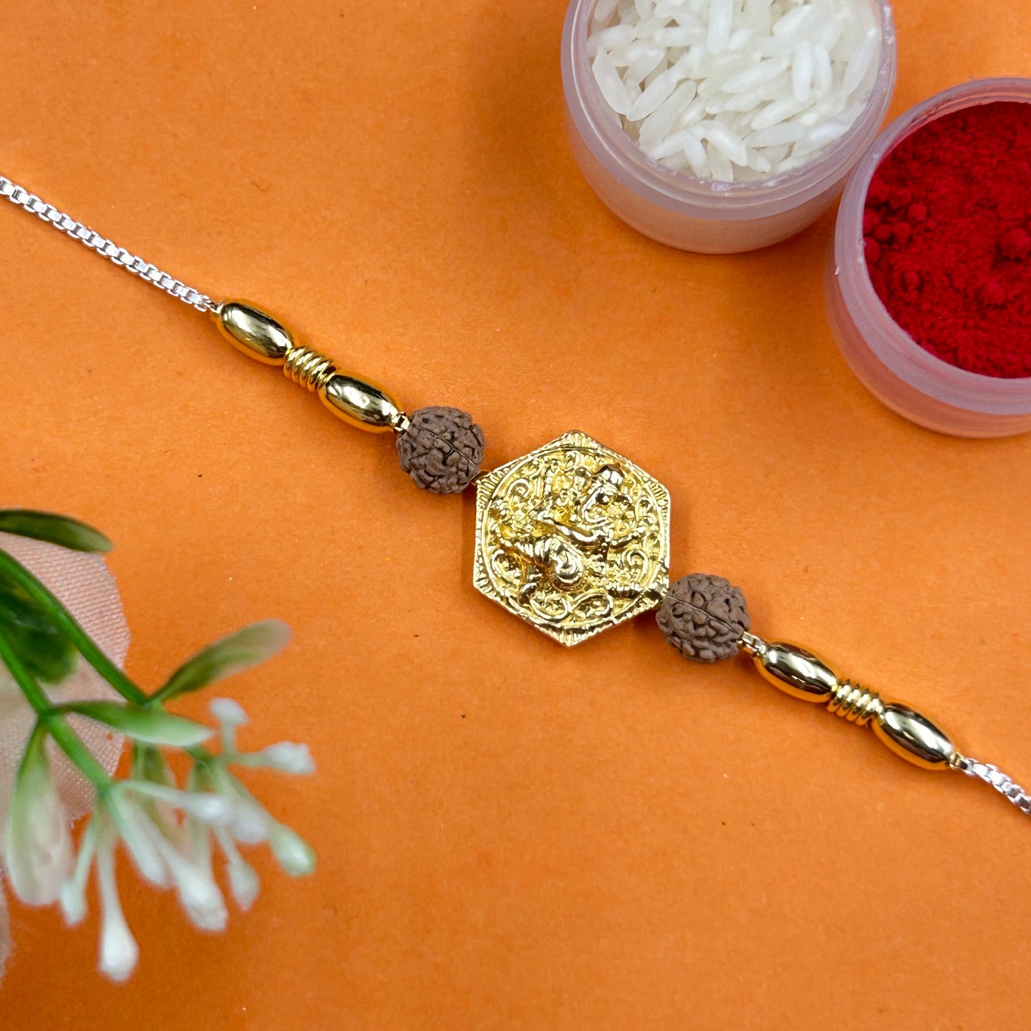 Yellow Gold Ganpati Rakhi with Rudraksh