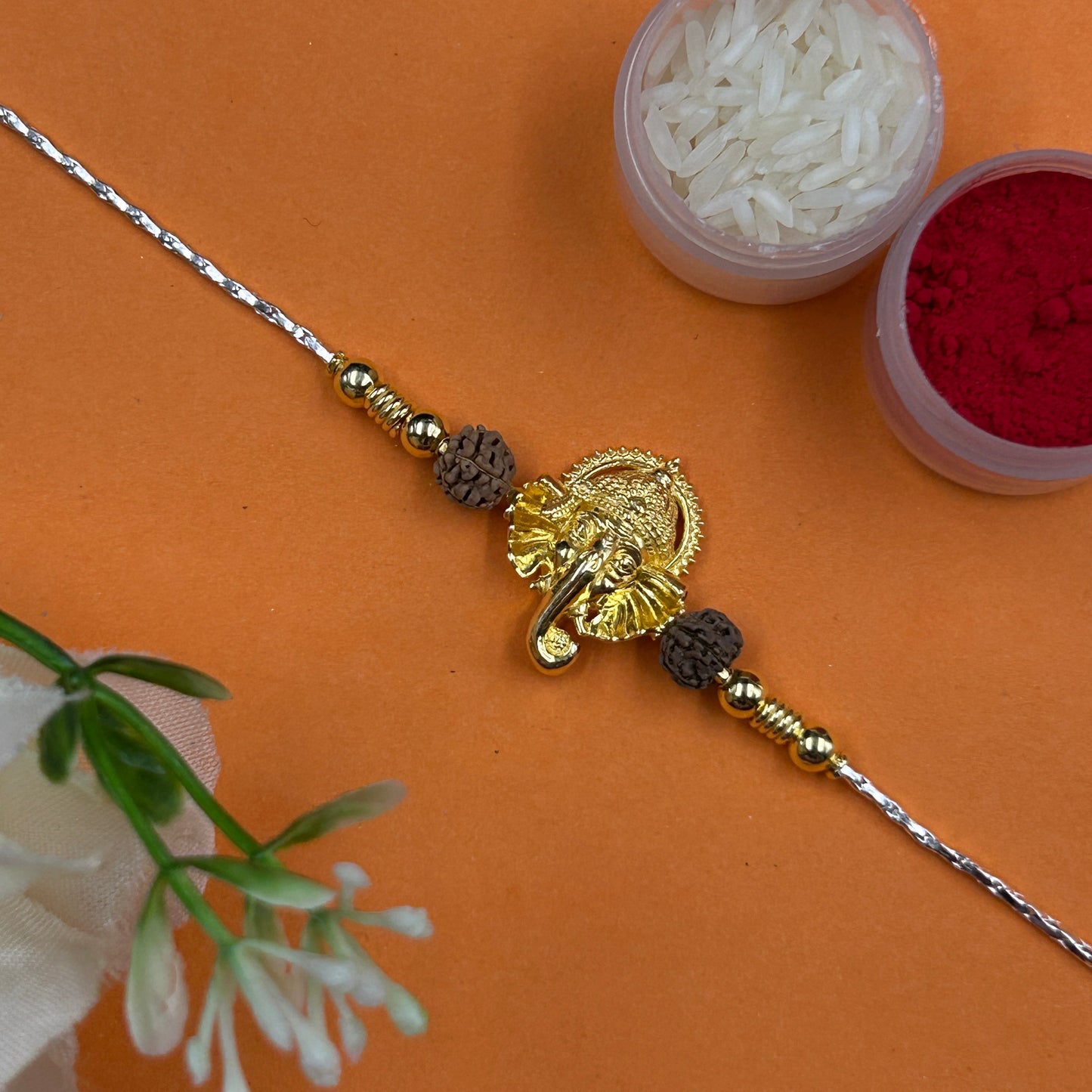 Yellow Gold Ganesh Rakhi with Rudraksh