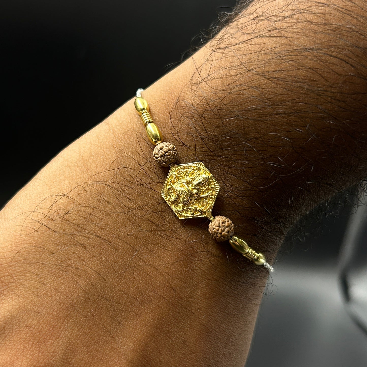 Yellow Gold Ganpati Rakhi with Rudraksh