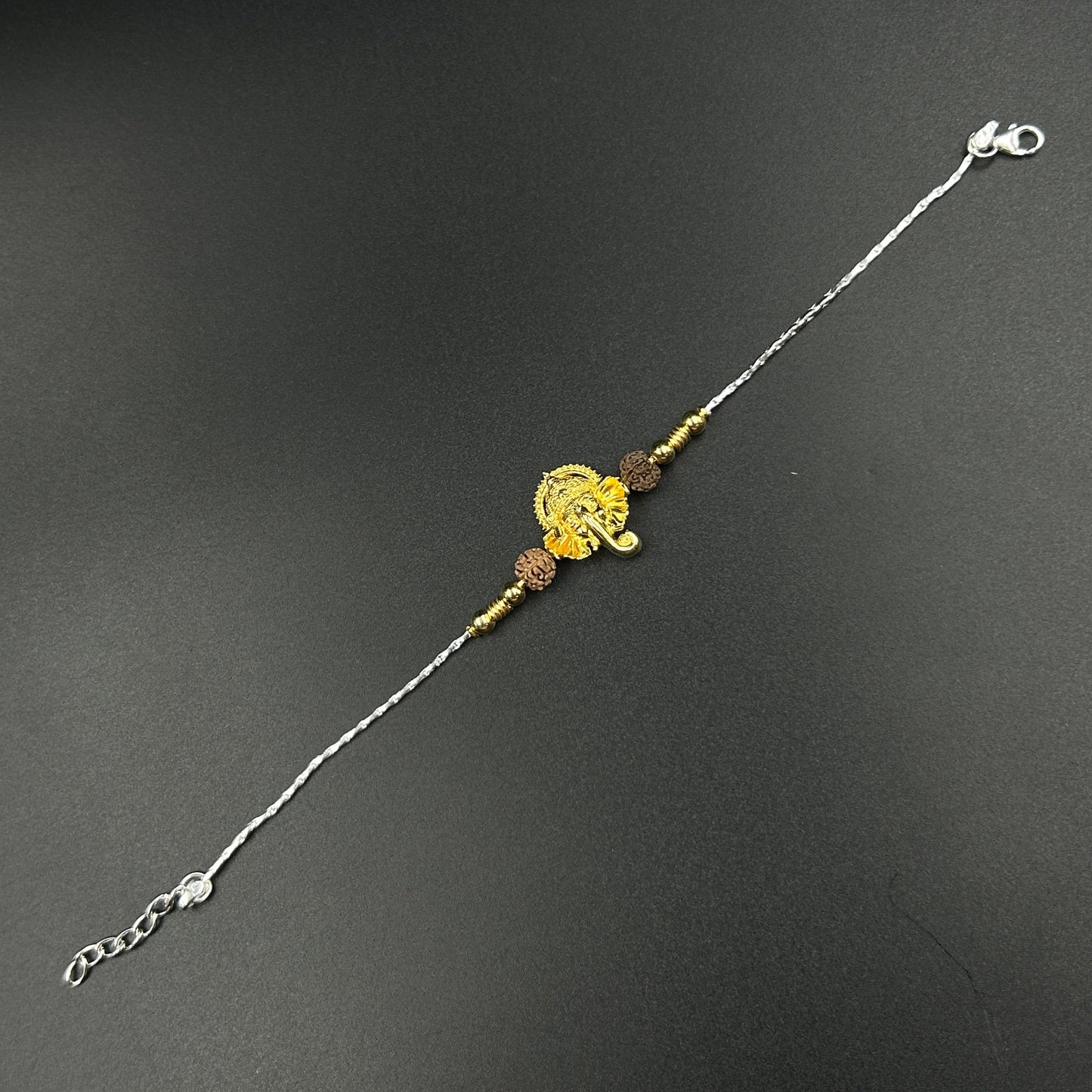 Yellow Gold Ganesh Rakhi with Rudraksh