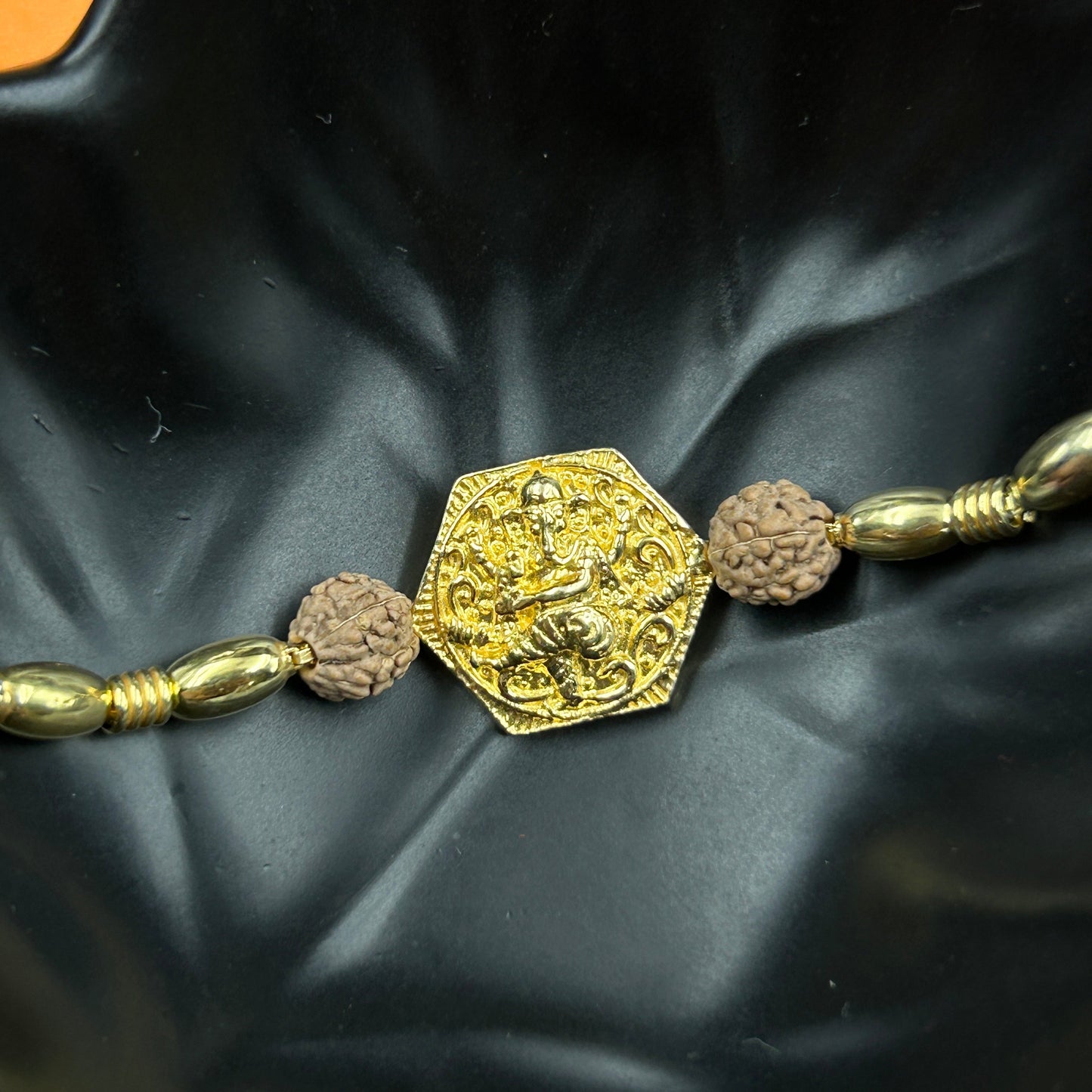 Yellow Gold Ganpati Rakhi with Rudraksh