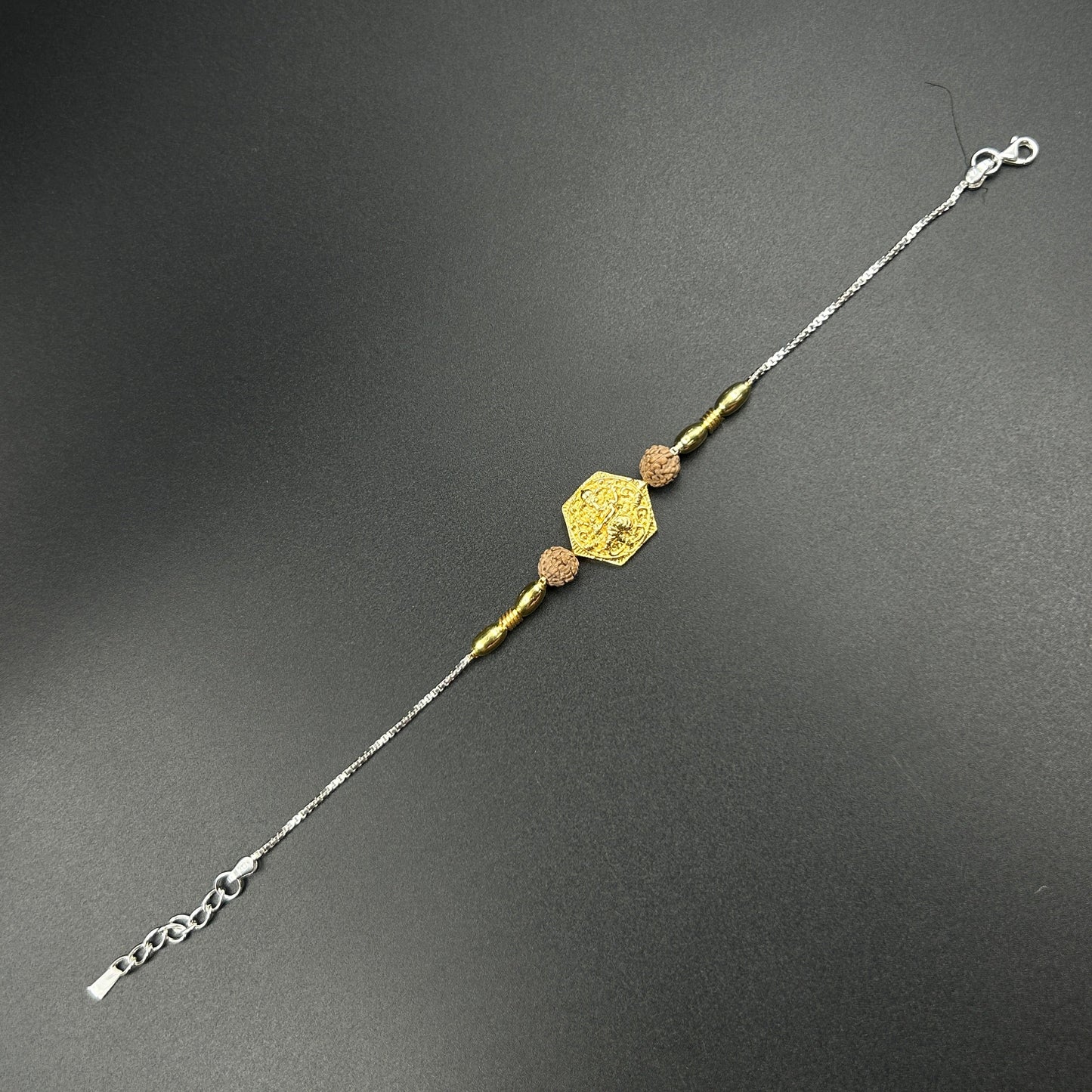 Yellow Gold Ganpati Rakhi with Rudraksh