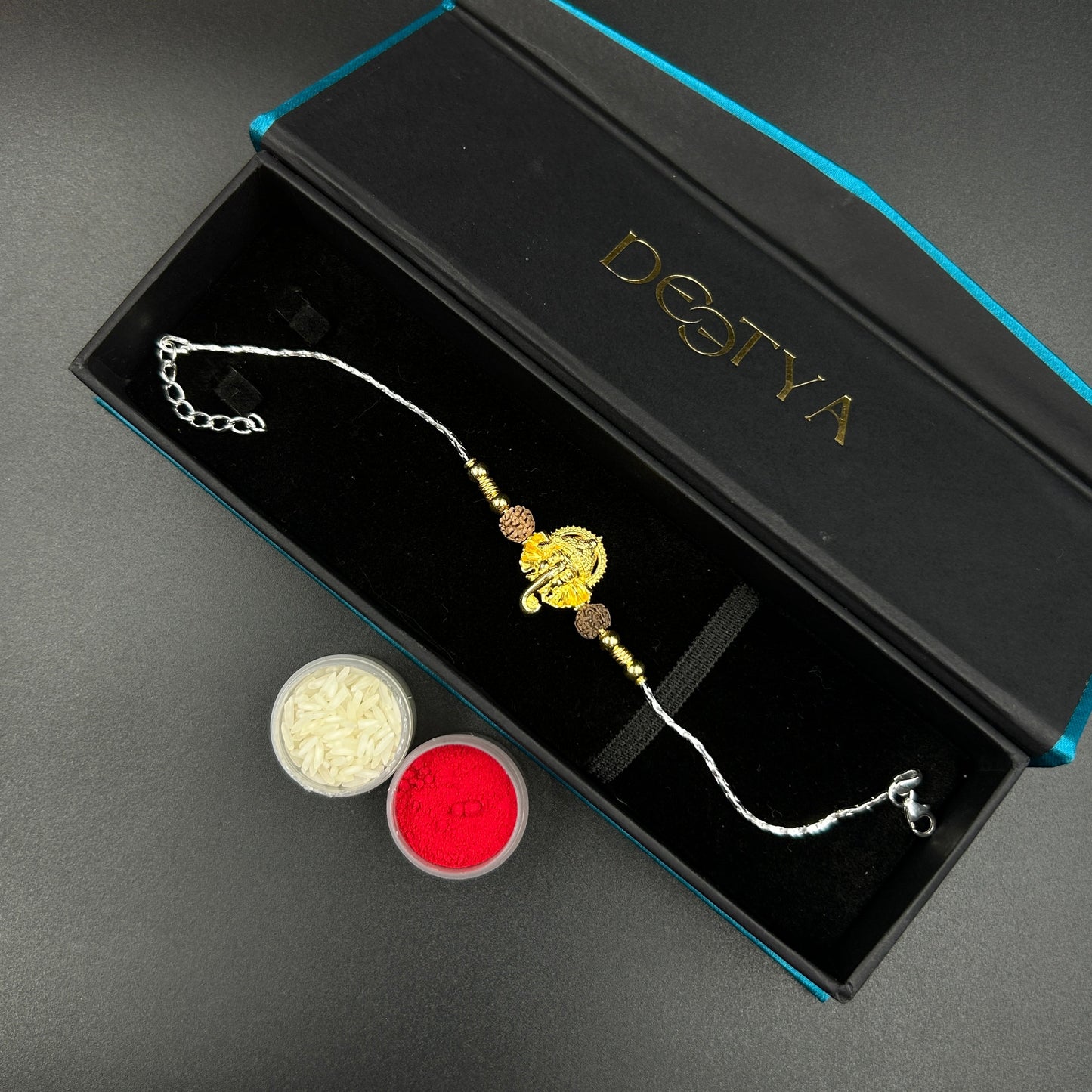 Yellow Gold Ganesh Rakhi with Rudraksh