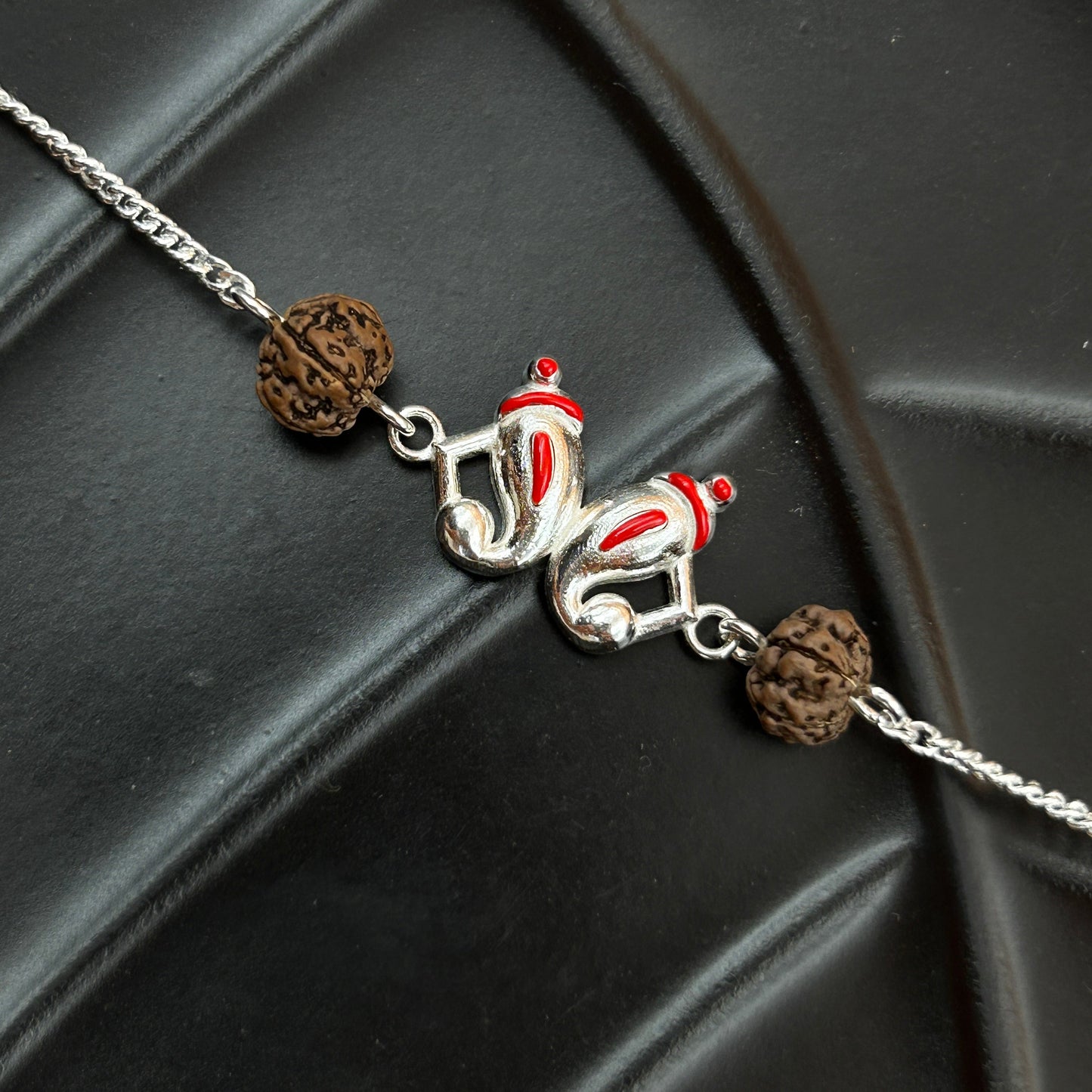 Silver Ganesh Rakhi with Rudraksh