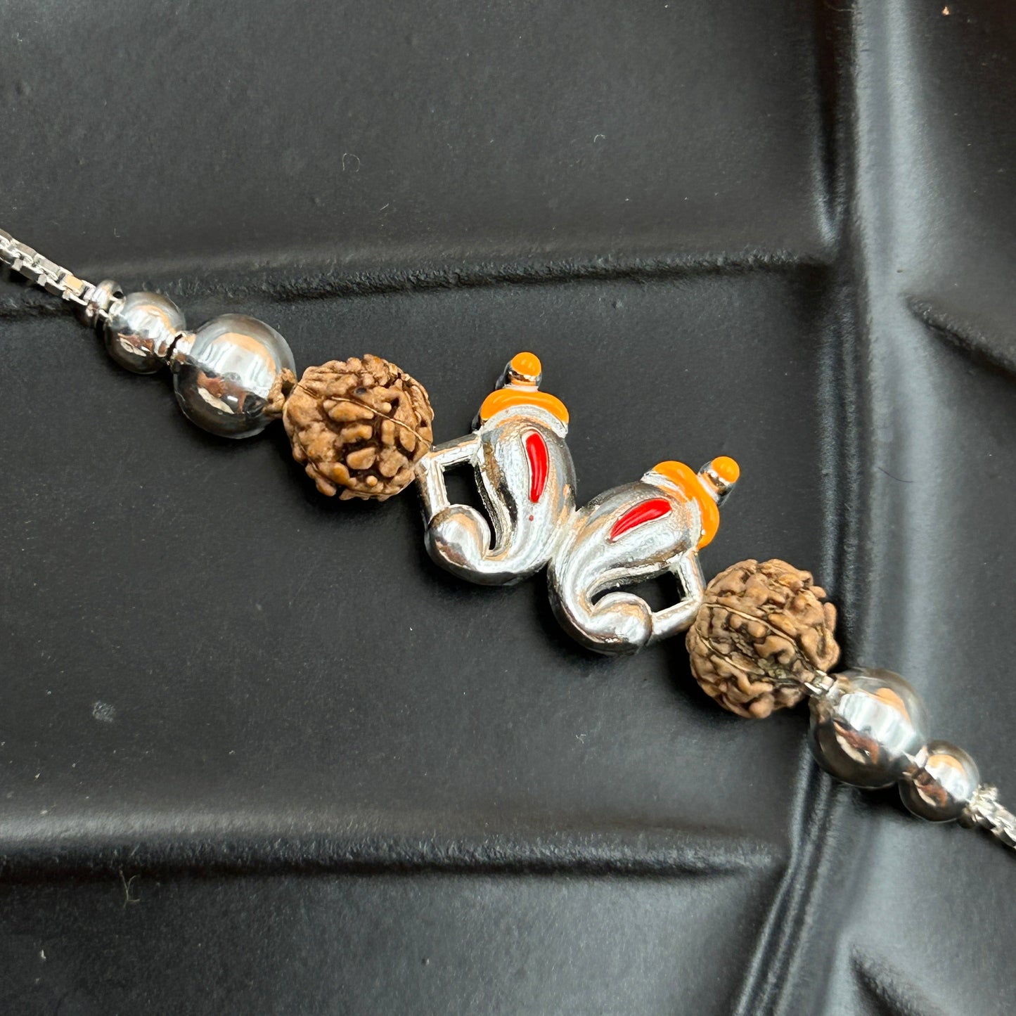 Silver Ganesh Rakhi with Rudraksh