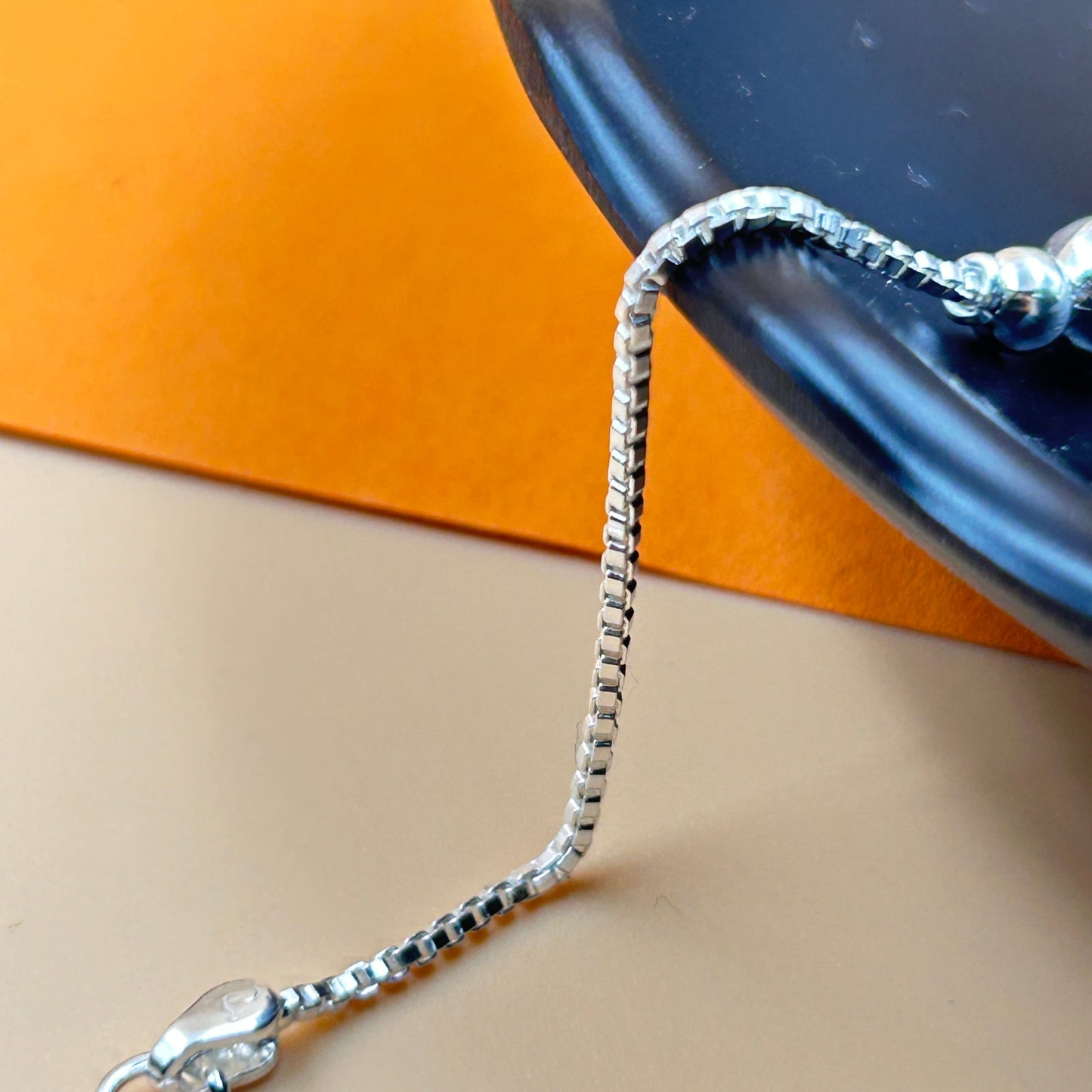 Silver Ganesh Rakhi with Rudraksh