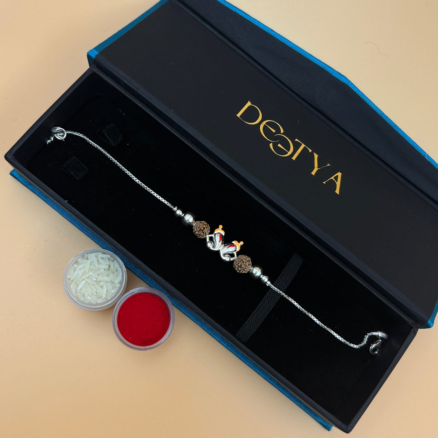 Silver Ganesh Rakhi with Rudraksh