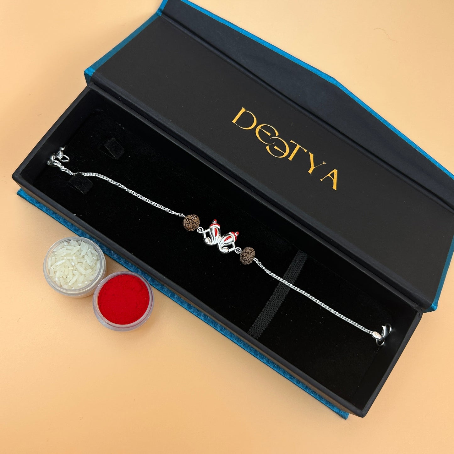 Silver Ganesh Rakhi with Rudraksh