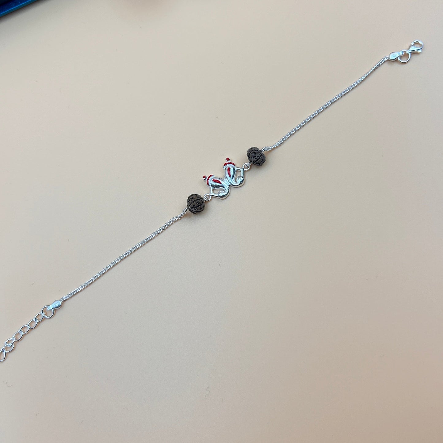 Silver Ganesh Rakhi with Rudraksh