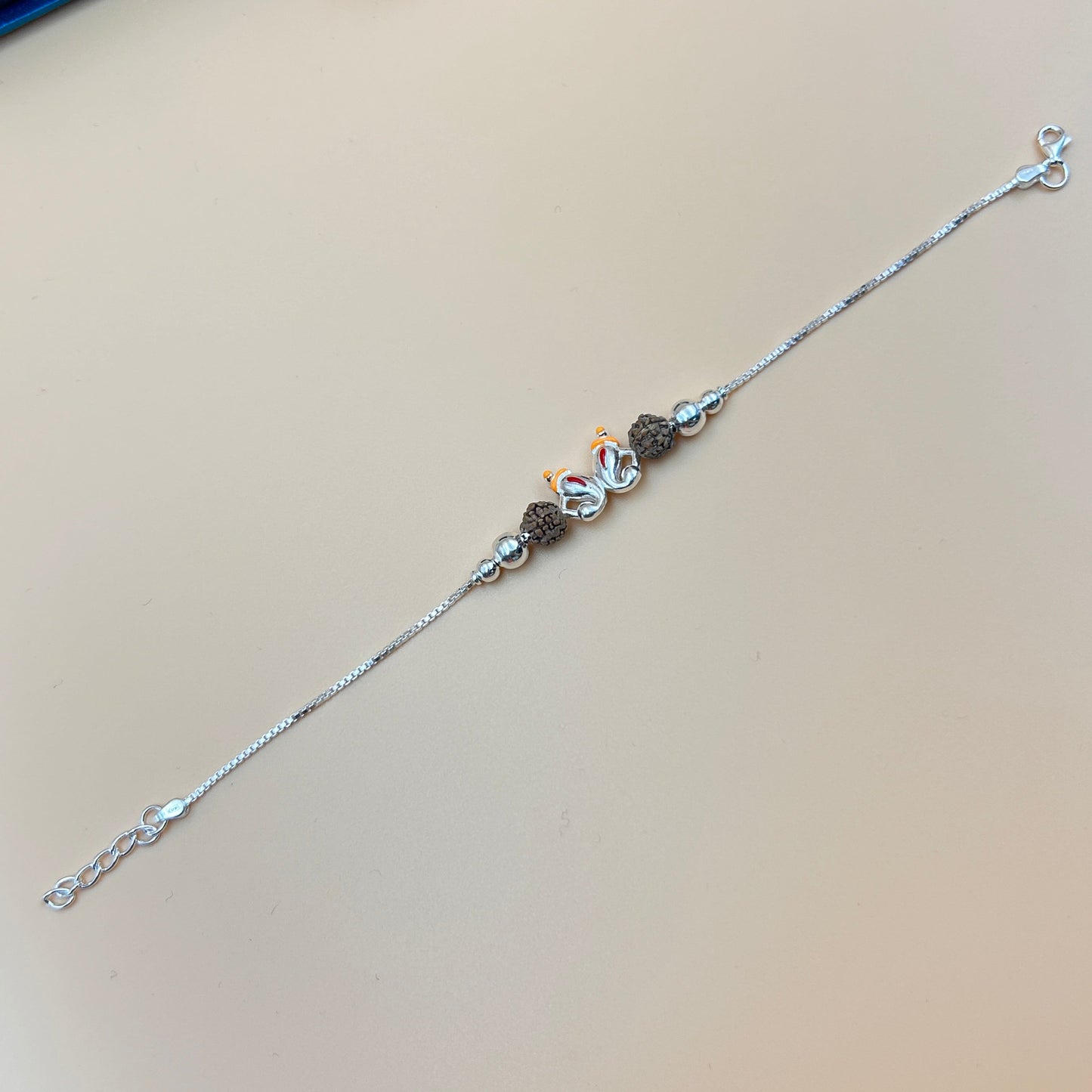 Silver Ganesh Rakhi with Rudraksh