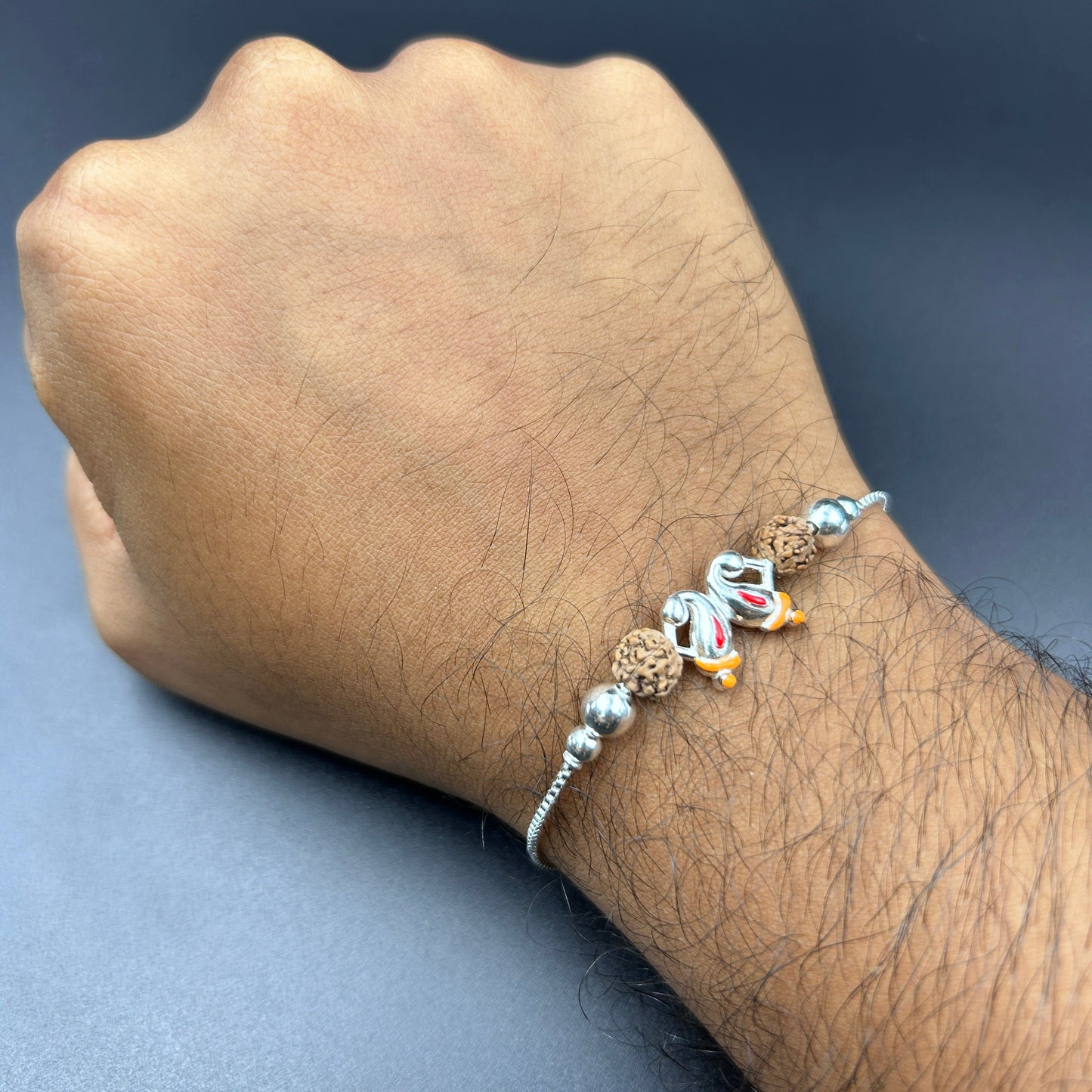 Silver Ganesh Rakhi with Rudraksh