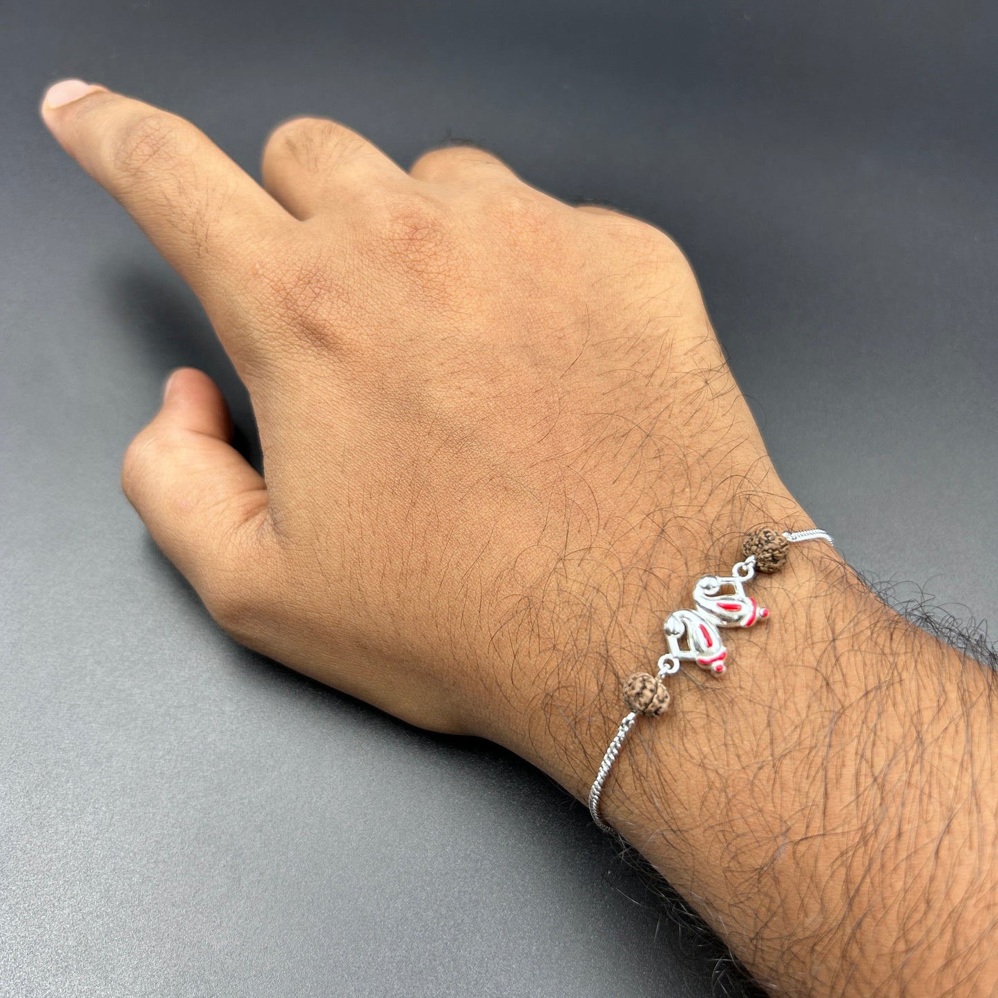 Silver Ganesh Rakhi with Rudraksh