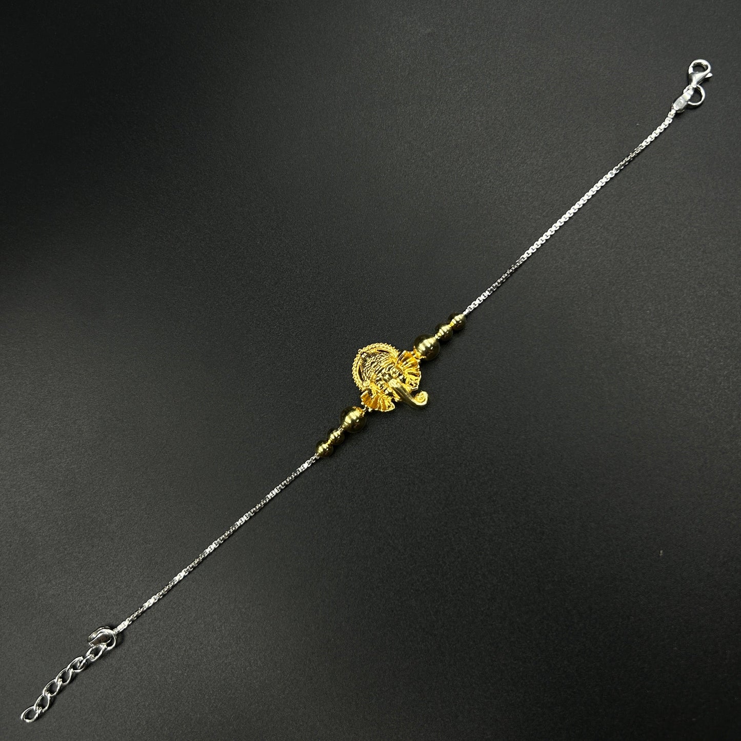 Yellow Gold Ganesh Rakhi without Rudraksh