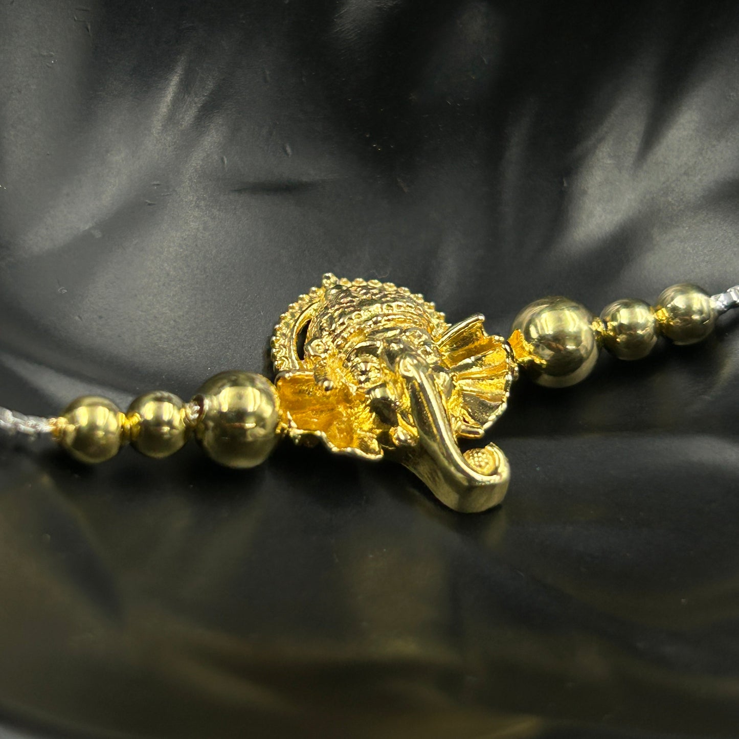 Yellow Gold Ganesh Rakhi without Rudraksh