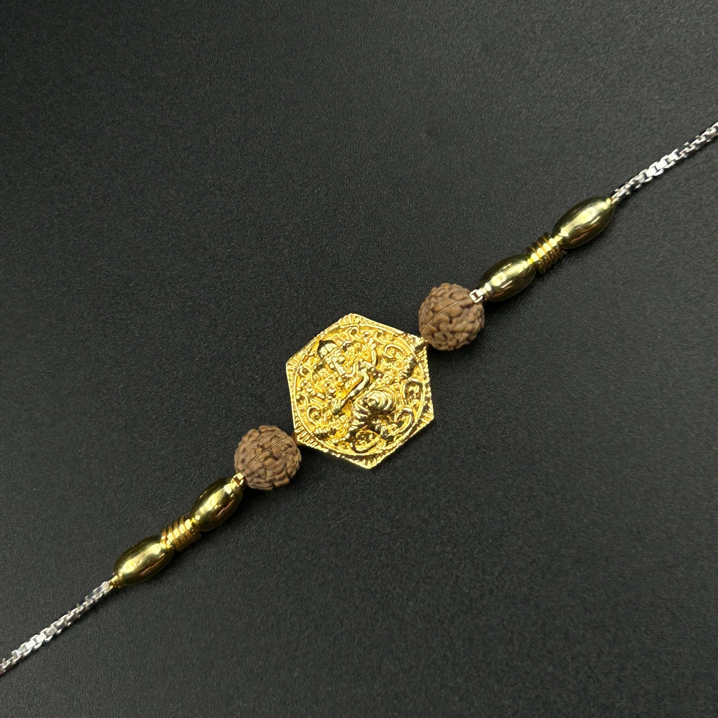 Yellow Gold Ganpati Rakhi with Rudraksh